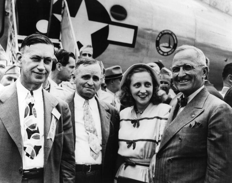 Harry Truman lands at the Fairfax Airport in Kansas City, Kansas for the first time as president of the United States and is greeted from L to R by Mayor of Independence, Roger Sermon;  Vivian Truman, the president's brother; and Margaret Truman, daughter of the President.  