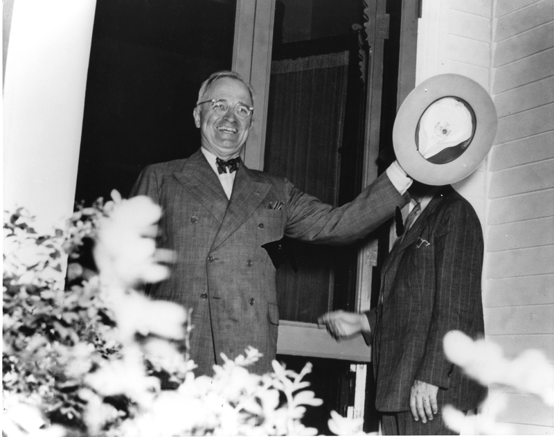 Harry Truman greeting well wishers after arriving at 219 N. Delaware for the first time as president of the United States.